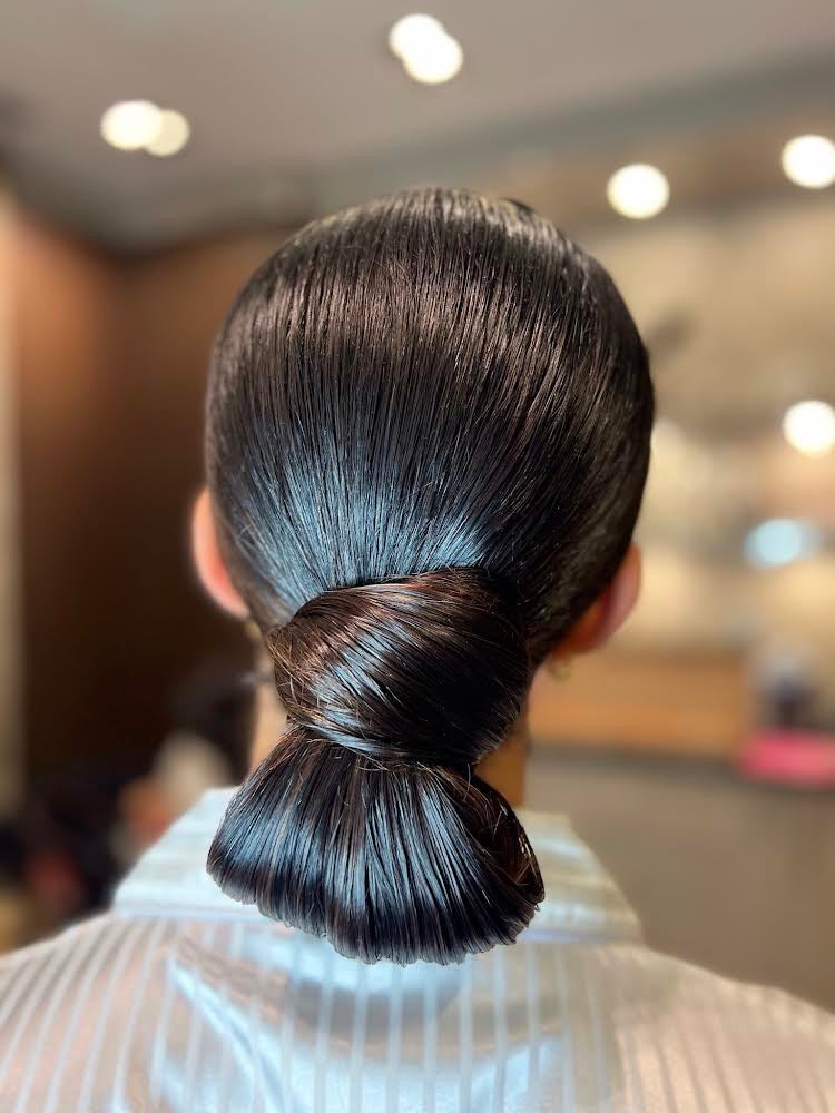 Sleek bridal updo by Tempt(d) Studio, Toronto